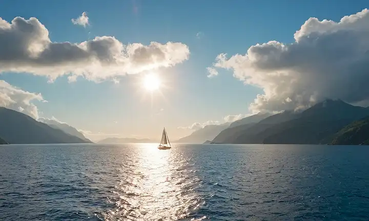globo 3D con capas transparentes, nubes giratorias, mares resplandecientes, sol brillando en la distancia, un pequeño velero, un horizonte distante con terreno montañoso, cielos azules suaves