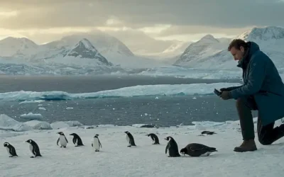 paisaje helado con pingüinos en vuelo